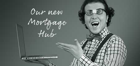 Guy looking at laptop happy to hear of new Mortgage Hub
